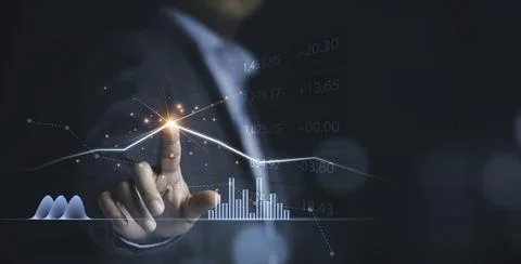 Businessman drawing virtual technical graph and chart for analysis stock Stock Photos