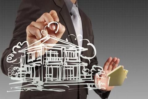 Businessman draws building development Ilustración de archivo