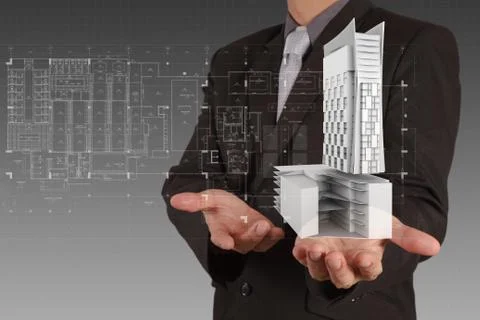 Businessman draws building development Ilustración de archivo