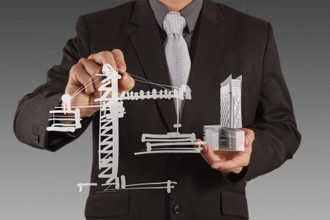 Businessman draws building development Ilustración de archivo
