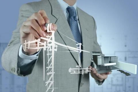 Businessman draws building development Ilustración de archivo