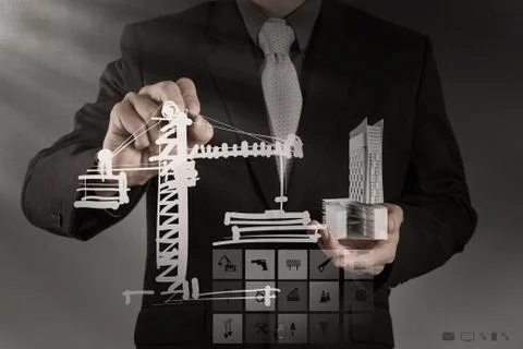 Businessman draws building development Ilustración de archivo