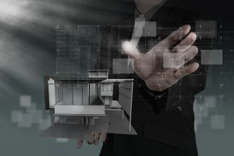 Businessman draws building development Stock Illustration