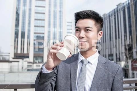 Businessman Drink Coffee At Outdoor