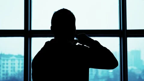 Businessman Drinking Coffee in Front of Window in Plaza Stock Footage 303072676