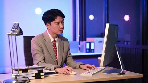 Businessman drinking coffee to get some energy for working overtime sitting.. Stock Footage 313577885
