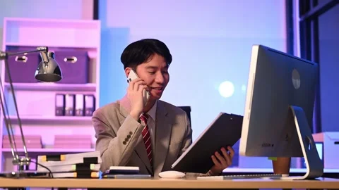 Businessman drinking coffee to get some energy for working overtime sitting.. Stock Footage 313577920