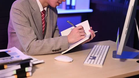 Businessman drinking coffee to get some energy for working overtime sitting.. Stock Footage 313577934