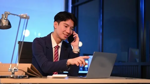 Businessman drinking coffee to get some energy for working overtime sitting.. Stock Footage 313577973