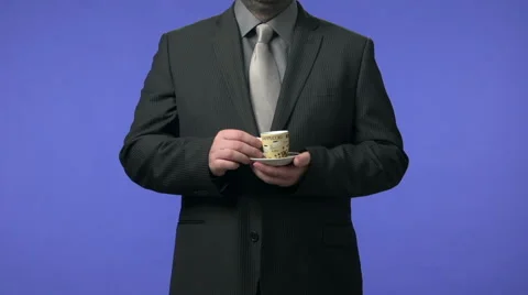 Businessman drinking coffee. High definition video shot on blue screen. Video stock 45936035
