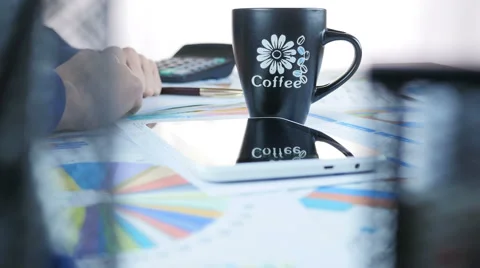 Businessman Drinking Coffee In Office Stockbeeldmateriaal 64058085