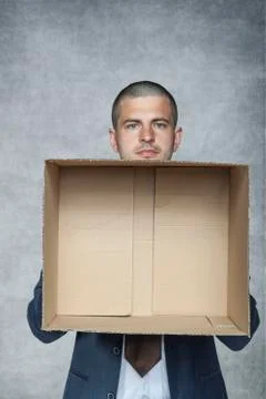 Businessman with an empty box Stock Photos
