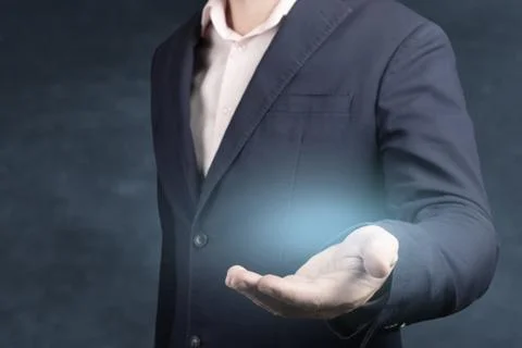 Businessman with empty hand. An empty workpiece. blue glow in the empty open  Stock Photos