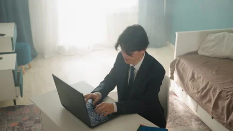 Businessman engaged in remote work during daylight hours. Focused young Stock Footage 342059857