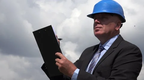 Businessman in a Engineer Construction Site Area Making New Technical Charts. Stock Footage 67419309