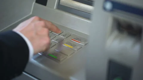 Businessman entering his pin code on keyboard of ATM, banking services, finance Stock Footage 90911664