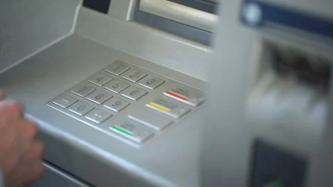 Businessman entering his pin code on keyboard of ATM, banking services, finance Stock Footage 90914920