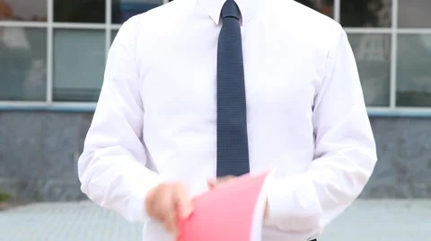 Businessman examining the catalog Stock Footage 54286840