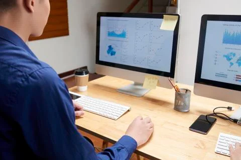 Businessman examining data on computer screen Stock Photos