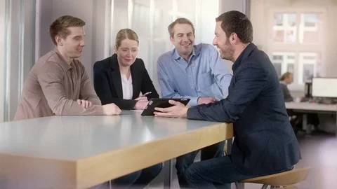 Businessman explains statistics on a tablet Stock Footage 72334626