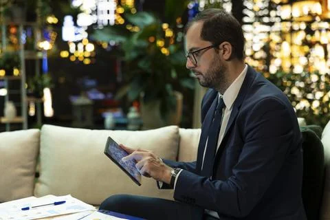 Businessman explores artificial intelligence visualization on tablet 스톡 사진