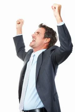Businessman expressing victory. Successful business man with arms raised on Stock Photos