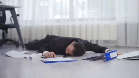 Businessman falling to the ground in the office. Stock Footage 218868949