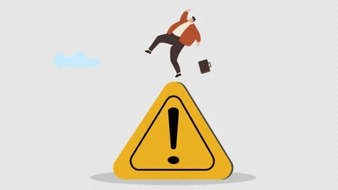 Businessman falling off a warning sign, symbolizing business risk Stock Footage 346347807