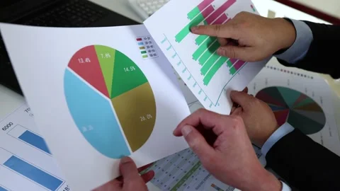 Businessman with financial statement analysis and statistics Stock Footage 236193884