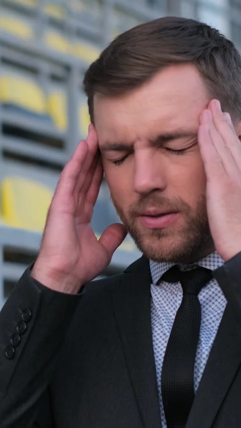 A businessman finding himself dealing with significant stress while navigating Stock Footage 318269740