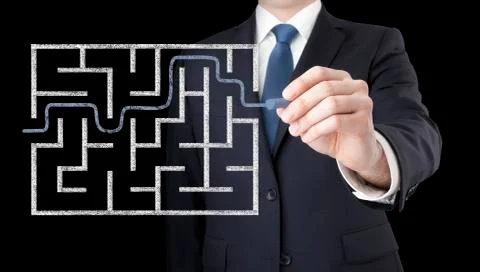 Businessman finding the solution of a maze Stock Photos