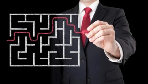 Businessman finding the solution of a maze Stock Photos