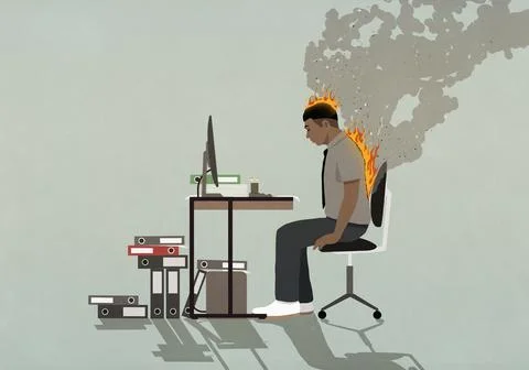 Businessman on fire working at computer at office desk Stock Illustration