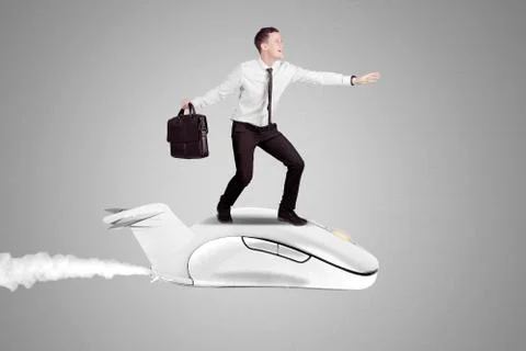 Businessman flying on a computer mouse Stock-Fotos