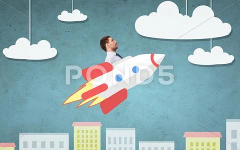 Businessman flying on rocket above cartoon city Stock Photos