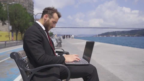 Businessman focused on his work working on his laptop. Slow motion. 스톡 동영상 212840279