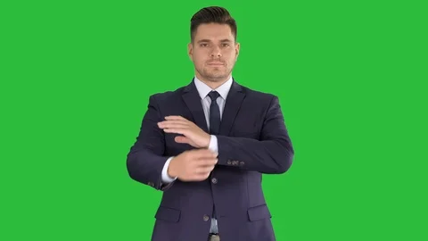 Businessman with fo;ded hands looking to camera on a Green Screen, Chroma Key. Stock Footage 106665065