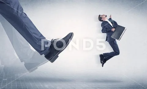 Businessman foot kicking small businessman Stock Photos