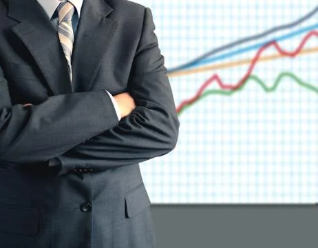 Businessman in front of graph Stock Photos