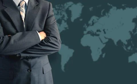 Businessman in front of world map Stock Photos