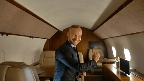 Businessman funny dancing inside of private jet Vidéo 113828274