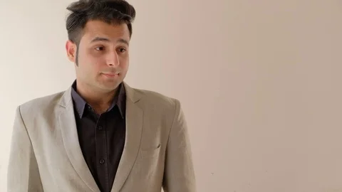 Businessman gets an idea solution to a problem and punches the air violently in  Stock Footage 100529711