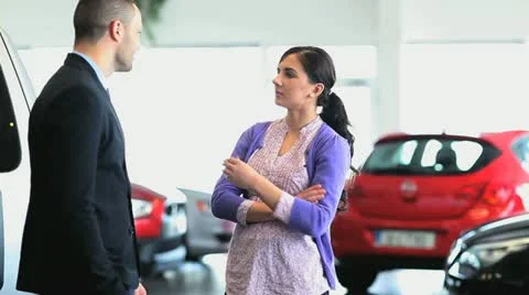Businessman giving car keys while shaking hands Stock Footage