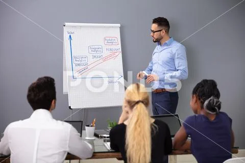 Businessman Giving Presenting At Conference In Office Stock Photos