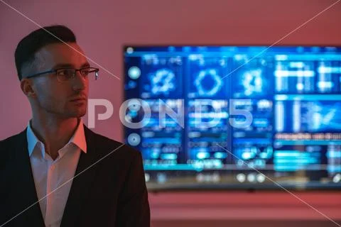 The businessman in glasses on displays background Stock Photos