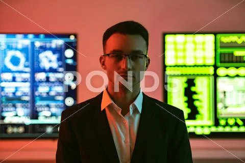 The businessman in glasses on screens background Stock Photos