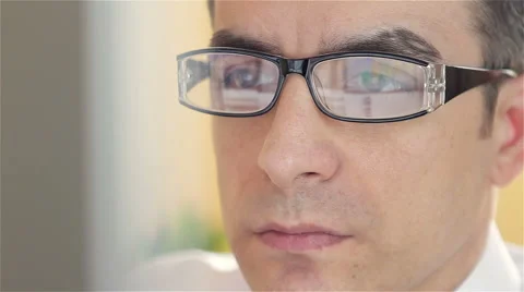 Businessman with glasses working on computer - closeup Stock Footage 61342073
