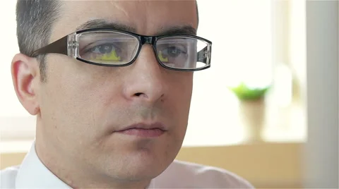 Businessman with glasses working on computer - closeup, dolly shot Stock Footage 61342077