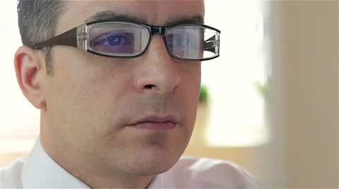 Businessman with glasses working on computer - closeup Stock Footage 61342139
