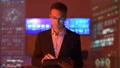 The businessman in glasses working with a tablet in the futuristic office 4k or 4k+ Resolution